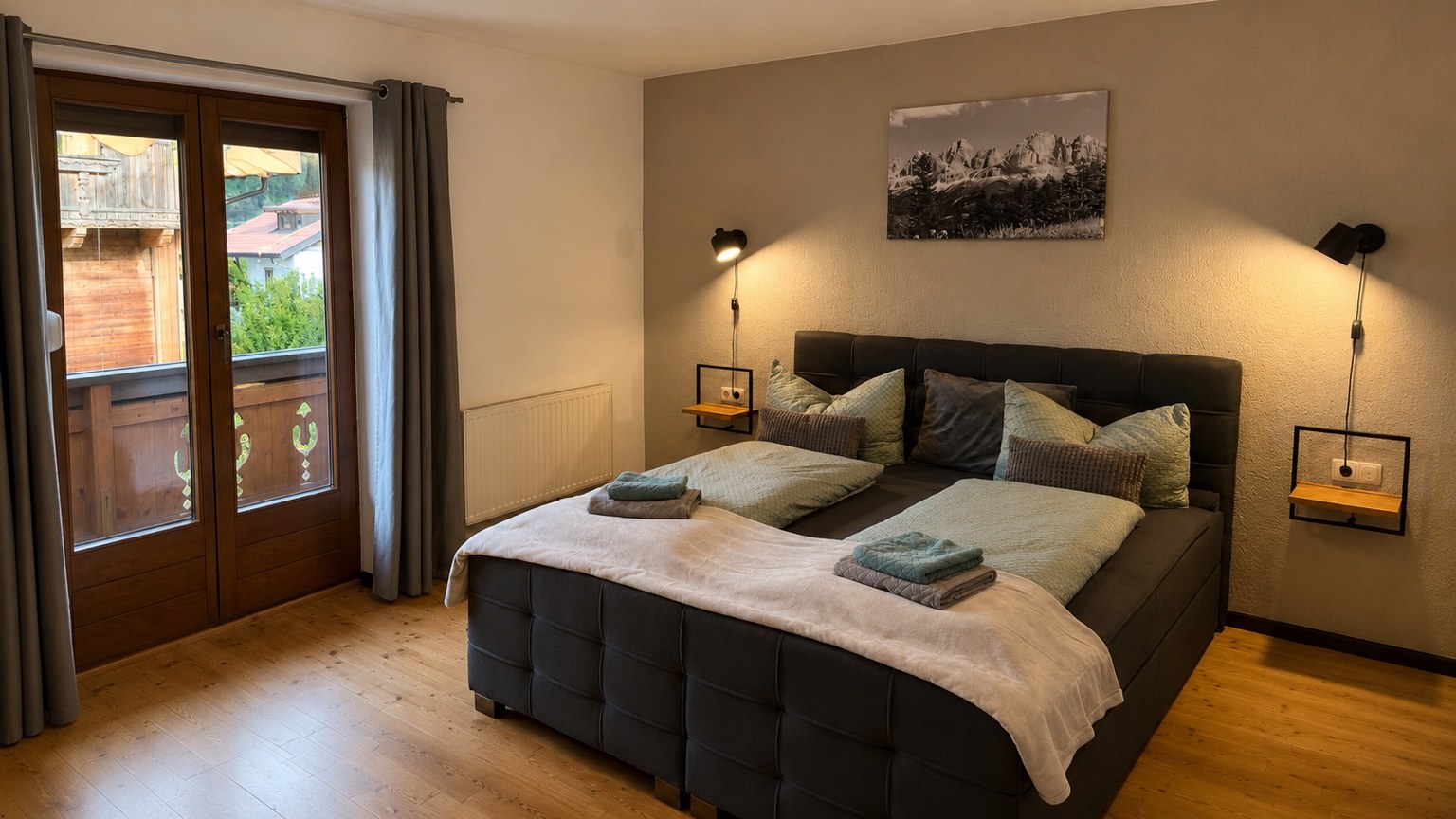 Bedroom with a double bed and balcony door